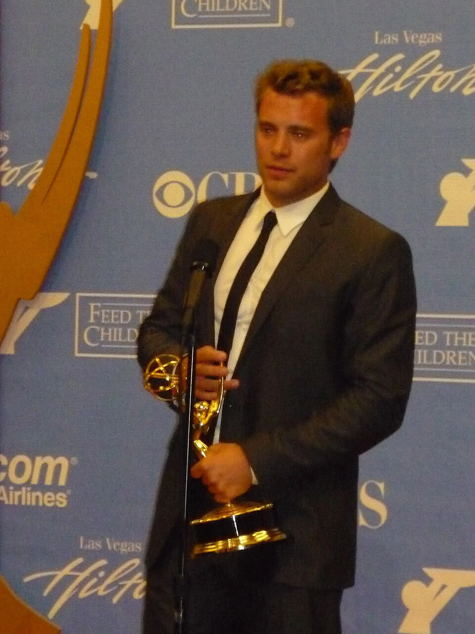 Billy Miller at the Daytime Emmy Awards holding an award